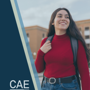 college age woman smiling in front of a college building